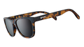 Three-quarter angle view of square brown tortoiseshell sunglasses with brown non-reflective lenses on a white background. 