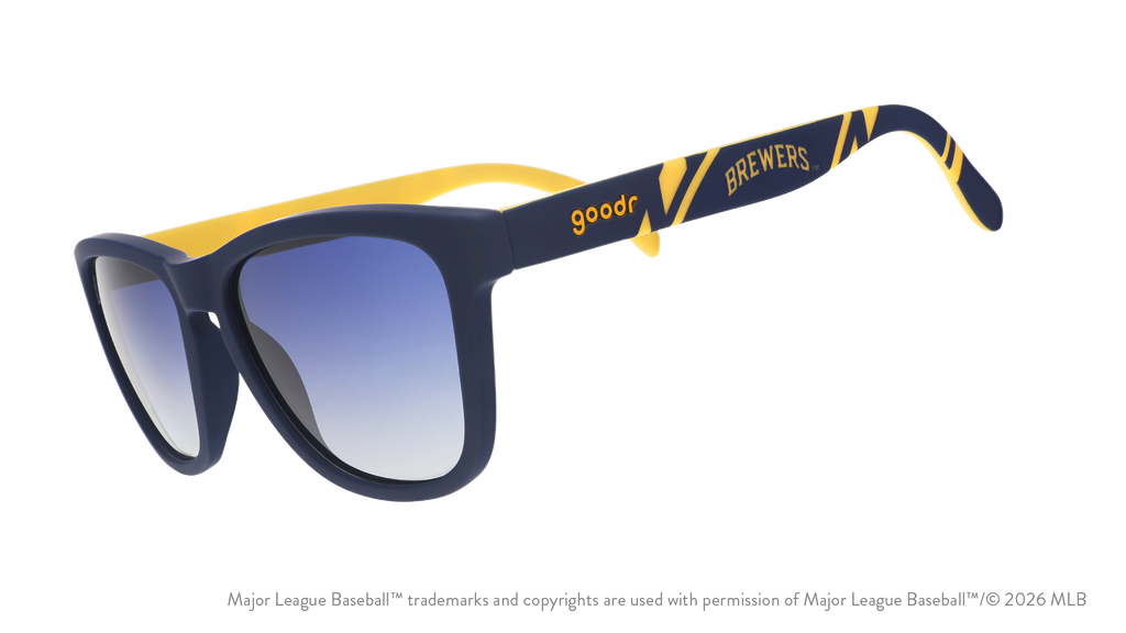 Three-quarter angle view of a pair of navy and yellow sunglasses featuring a Milwaukee Brewers logo on the arm. 