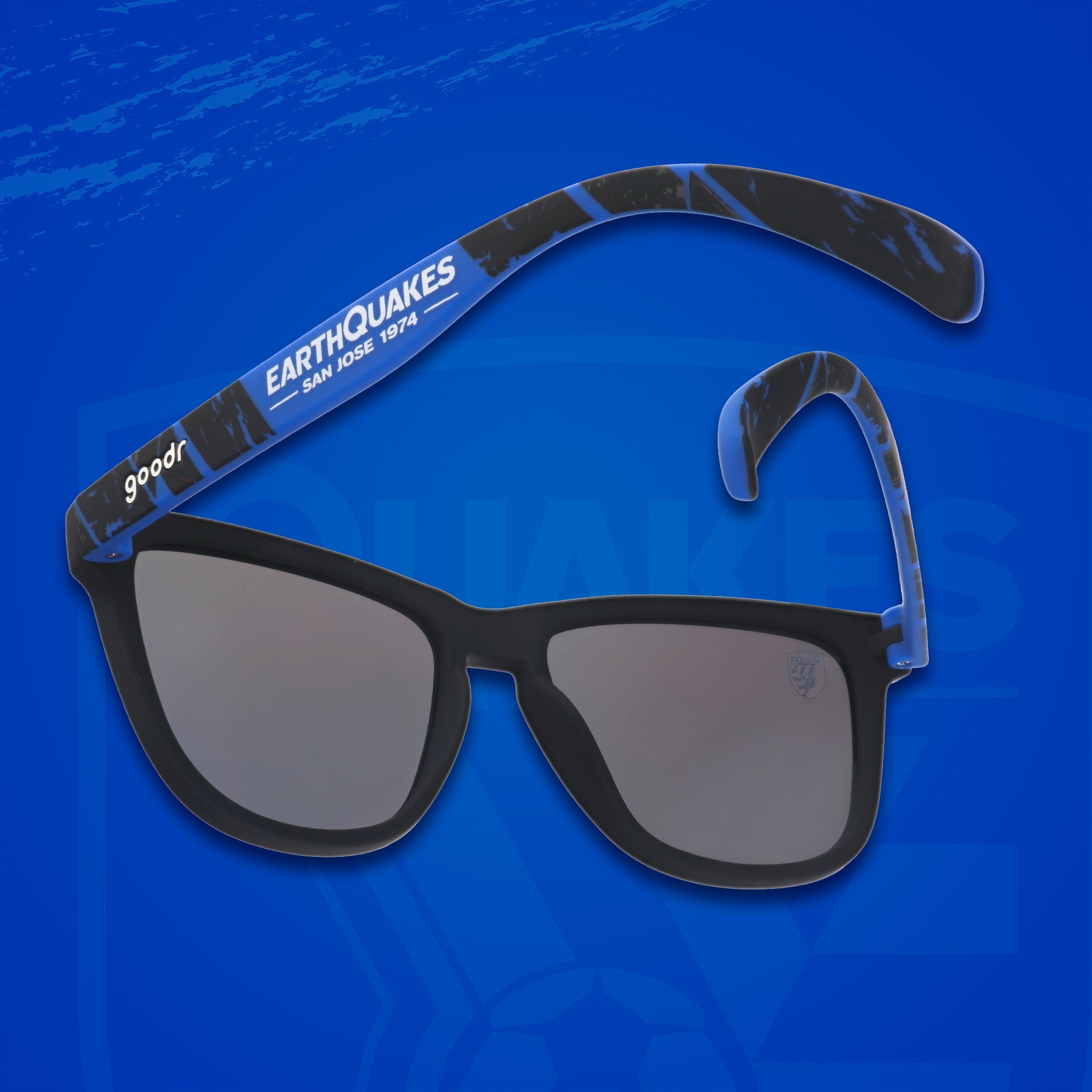 Three-quarter angle back view of MLS San Jose Earthquakes shades. Black+blue frames. Blue reflective lenses.