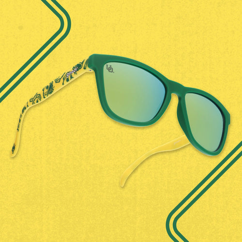 Three quarter angle of yellow-and-green shades featuring the Oregon Ducks duck mascot against a yellow background.